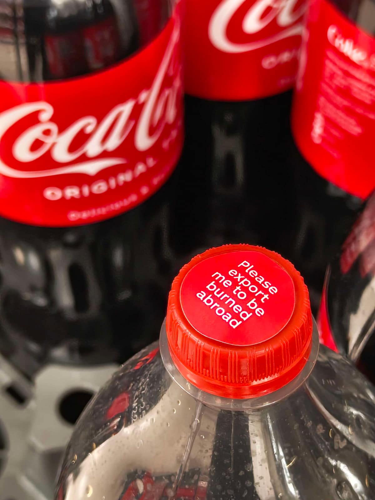 "Please export me to be burned abroad" Coca-Cola bottle stickers